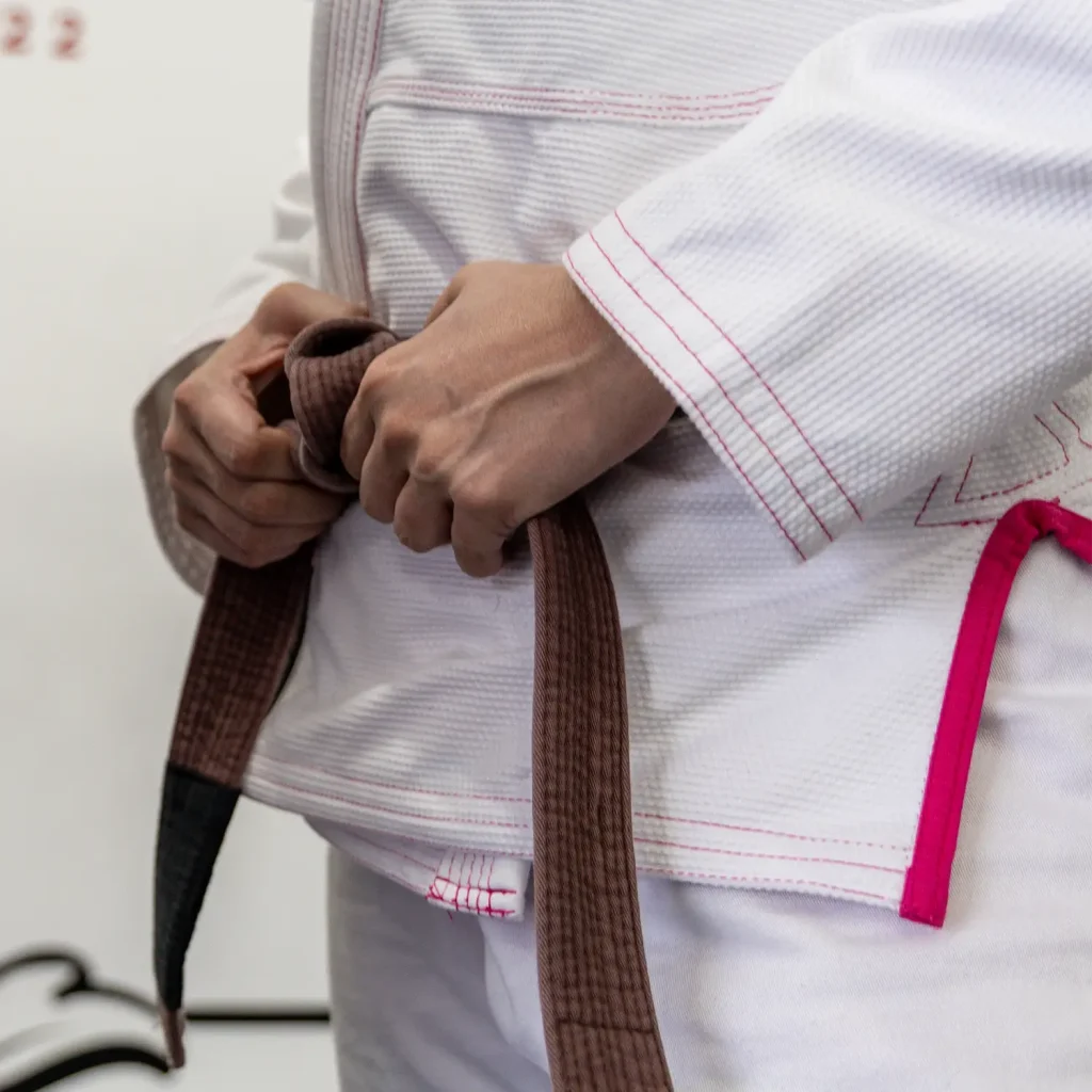 Child Brazilian Jiu-Jitsu belt with stripes, representing progress and achievement in a kids BJJ journey