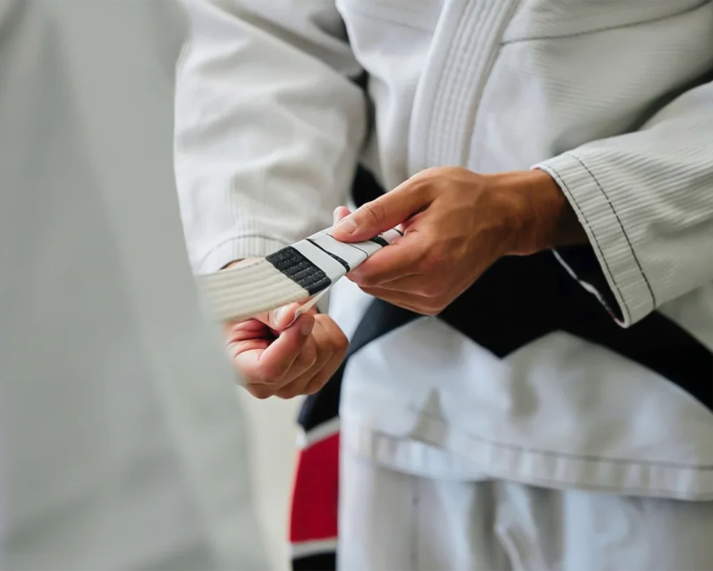 Child Brazilian Jiu-Jitsu belt with stripes, symbolizing progress and achievement in a kids BJJ training journey